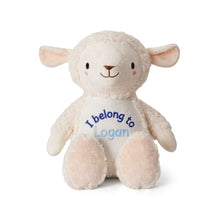 Load image into Gallery viewer, A plush sheep toy in cream and pale pink, with embroidered blue and light blue text on its belly reading 'I belong to Logan'.