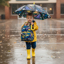 Load image into Gallery viewer, Child holding a colorful umbrella and backpack in the rain