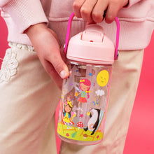 Load image into Gallery viewer, Child holding a pink water bottle with cartoon designs on a pink background