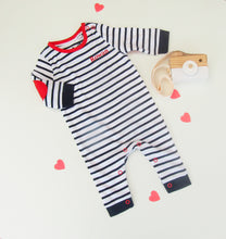 Load image into Gallery viewer, Striped baby romper with red accents on a light background