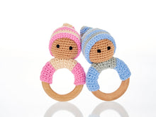Load image into Gallery viewer, Blue &amp; pink wooden &amp; crochet teething ring rattles.  The wood ring is half wrapped with crocheted cotton with a cute head with stitched black eyes with a matching bobby hat.