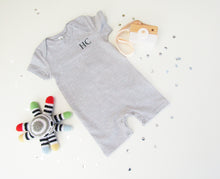 Load image into Gallery viewer, Baby all in one bodysuit. grey &amp; white stripe with envelope neck and popper fastening around the legs.